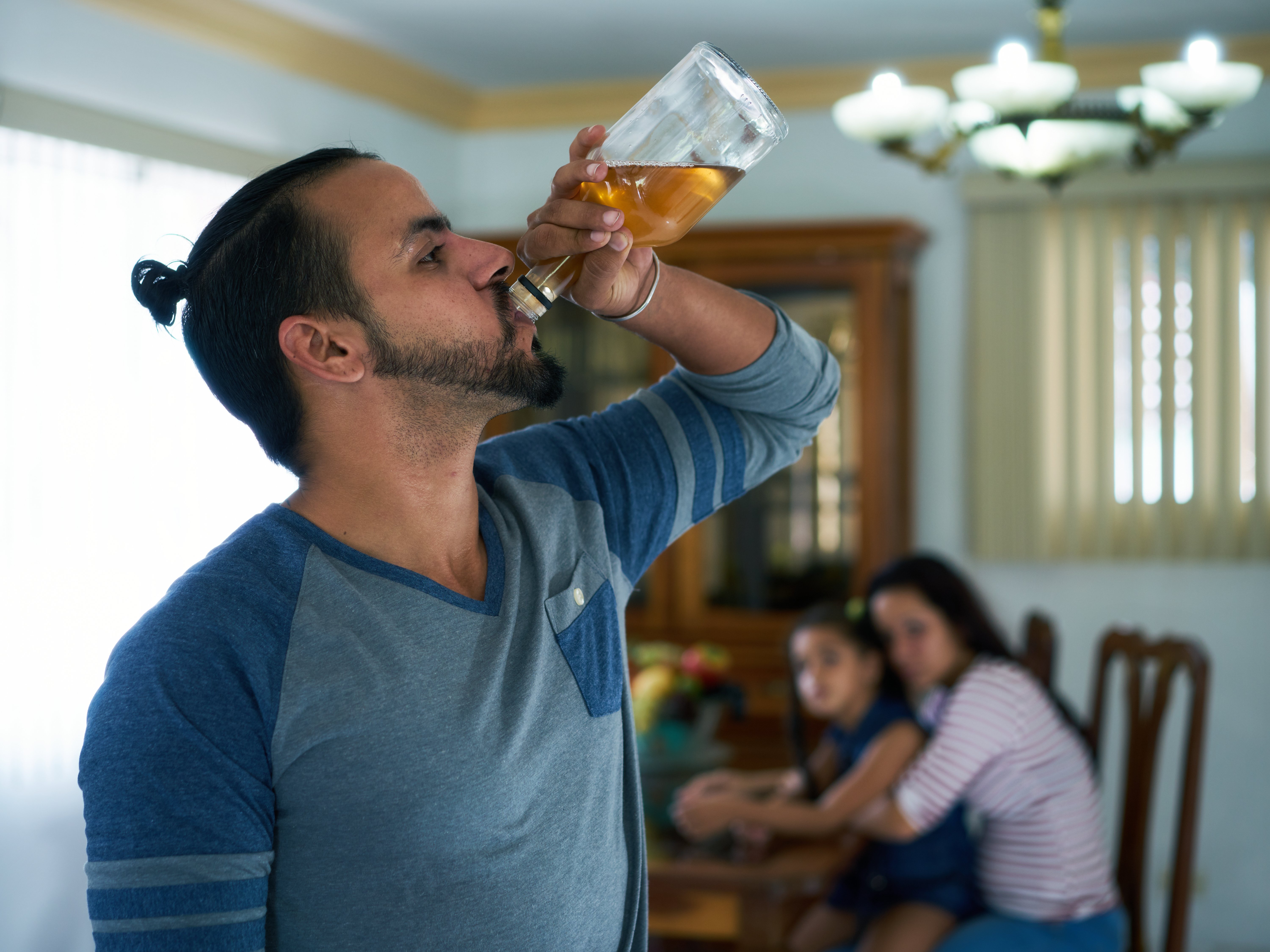 graphicstock-social-issues-abuse-and-aggression-on-women-alcoholic-latino-man-and-sad-woman-crying-at-home-violent-husband-and-abused-wife-with-child_ScMa546PwW